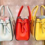 Side view of three colorful purses